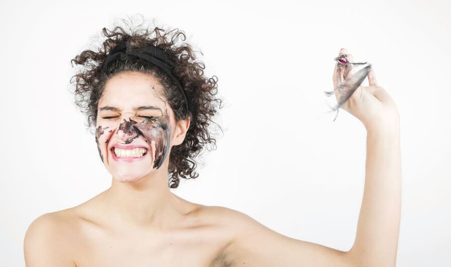 woman performs rejuvenating facial skin treatment